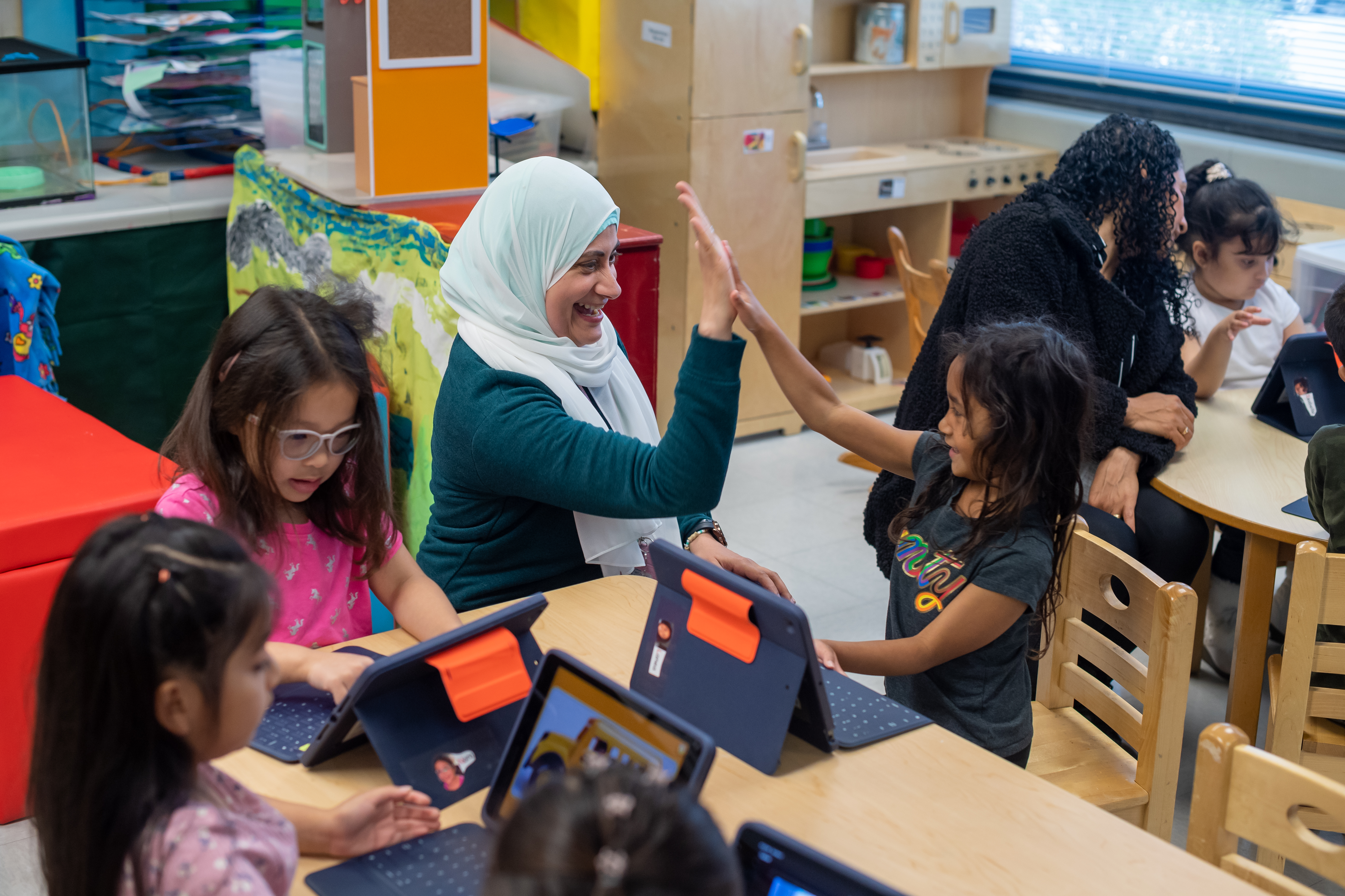 Teacher working with students