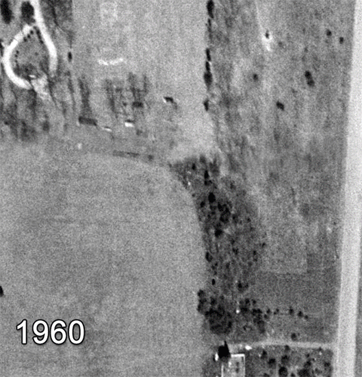 This series of aerial photographs shows Forestdale Elementary School from directly overhead in 1960, 1976, 1990, 1997, 2009, and 2017. The 1960 aerial is in black and white. The school site is undeveloped and is still a part of the Oak Grove estate. The school site is part open-field and part forest. The 1976 photograph is in color and shows the building as originally constructed without a gymnasium. The driveway and bus loop are in the same configuration as they are today. The building is rectangular in shape and two courtyards are visible in the center of the structure. The Oak Grove home is visible to the northwest. The 1990 photograph shows the first addition to the school consisting of a gymnasium and music room. It has been added to the rear of the building. The 1997 photograph shows that the Oak Grove house has been torn down and the Sunrise Assisted Living facility has been constructed in its place. The newest additions to the school, consisting of a music room, art room, expanded main office, and five classrooms, have been constructed. In 2009, the modular classroom wing behind the school has been added. It is a very large addition, and approximately doubled the available classroom space. The 2017 photograph shows that additional trailers have been added outside the building. 